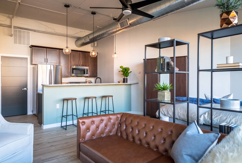 a kitchen and living room in a 555 waverly unit at The 22 Apartments, St. Louis, MO