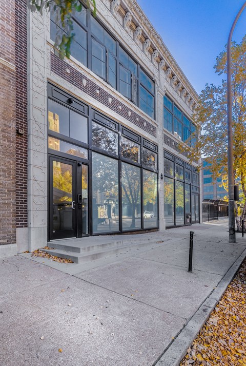 A building with a brick facade and large windows.