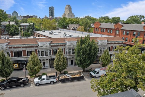 A city street with cars and buildings.