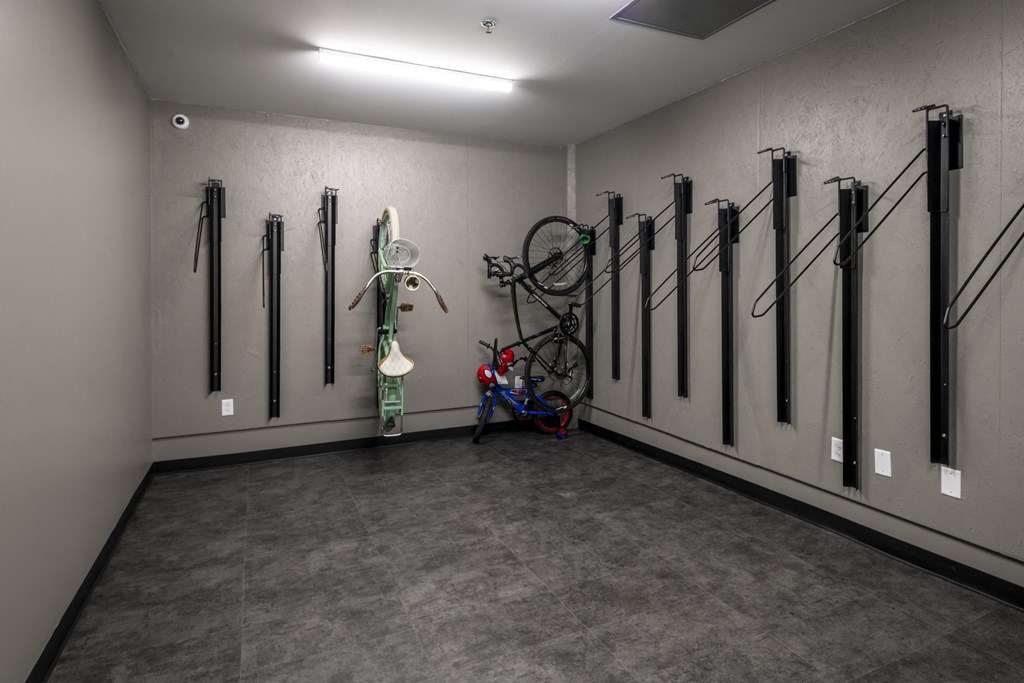 a room with bikes on the wall and a wall mounted bike rack at The Draper, St Louis, Missouri