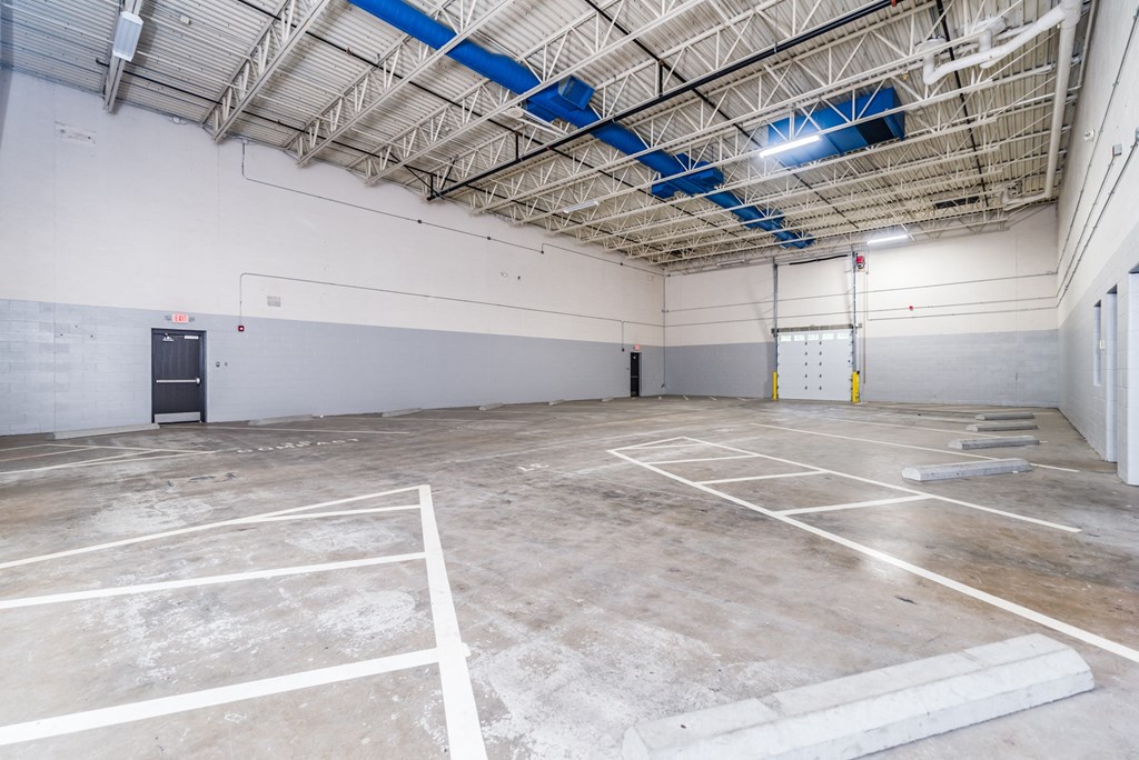 the inside of a large building with a parking lot