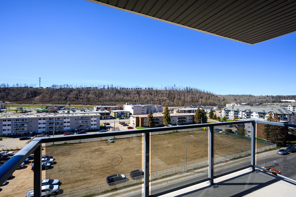 views of the city from the balcony of a condo