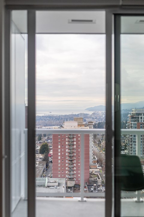 A view of a cityscape through a window.
