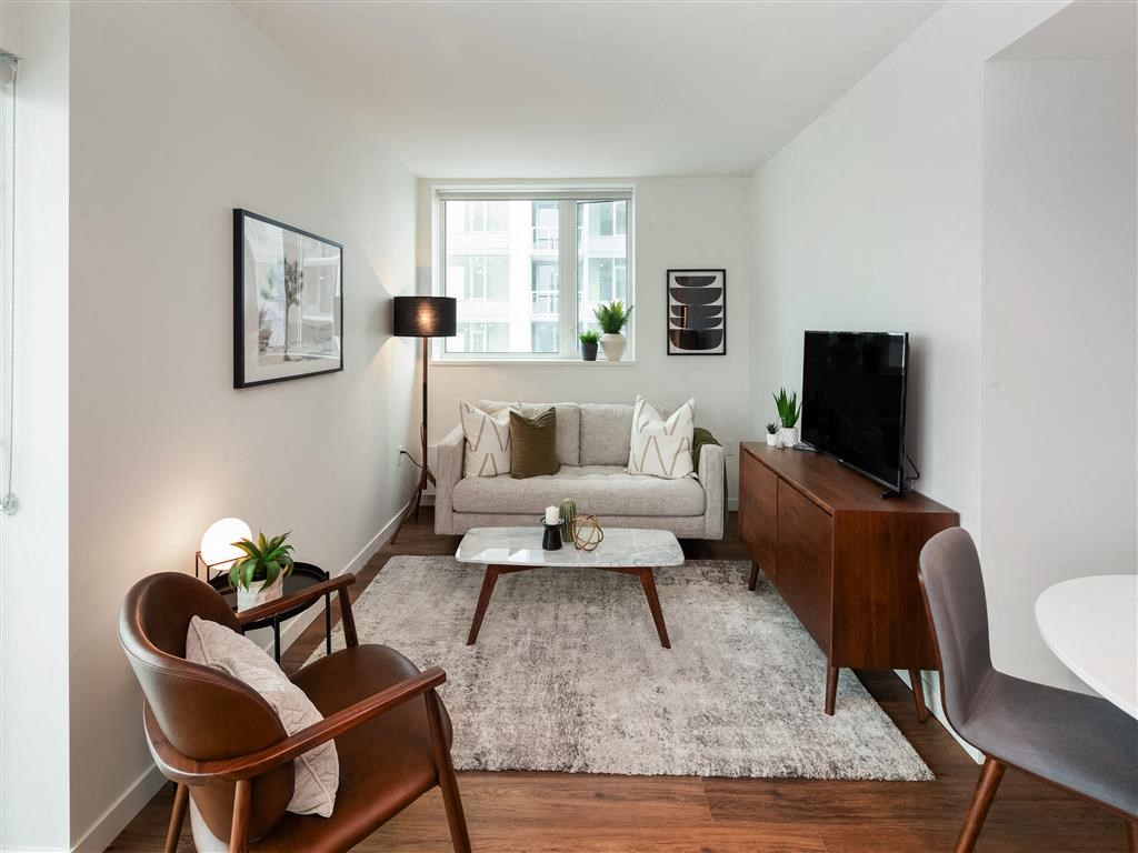 a living room with a couch and a tv