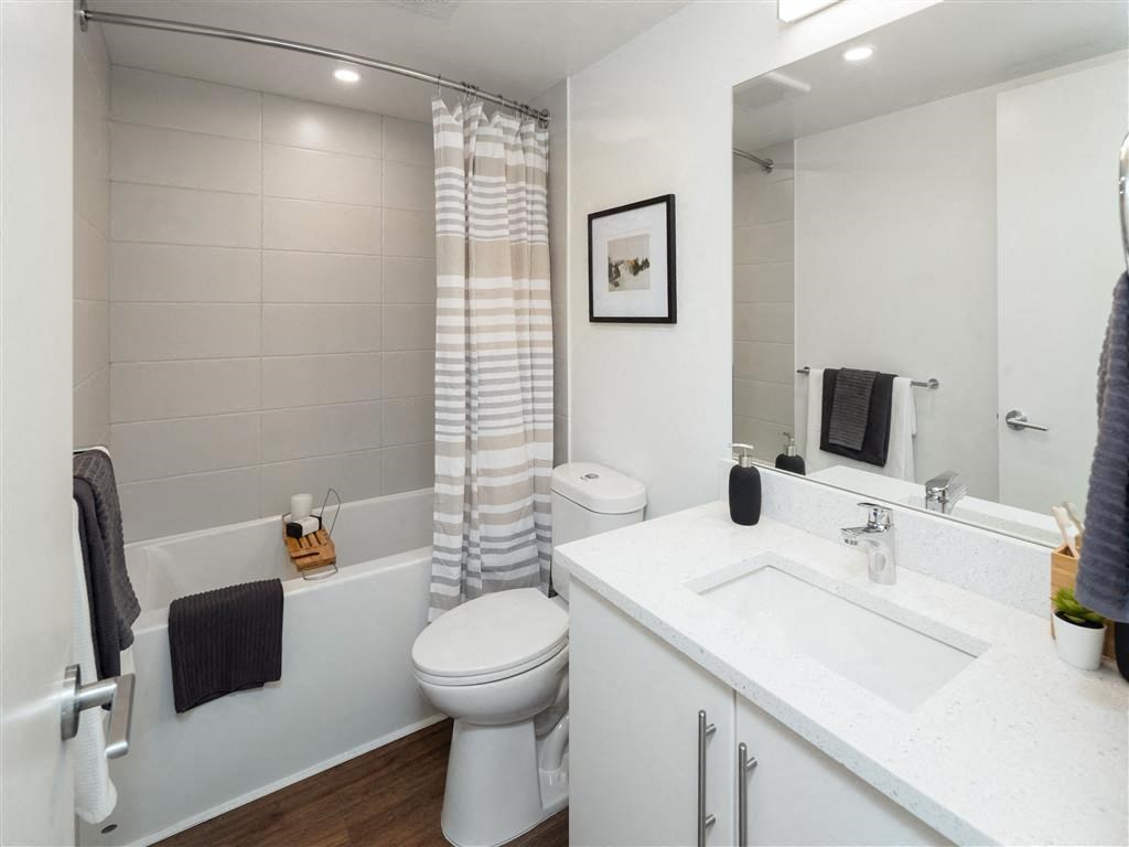 a bathroom with a sink toilet and a tub