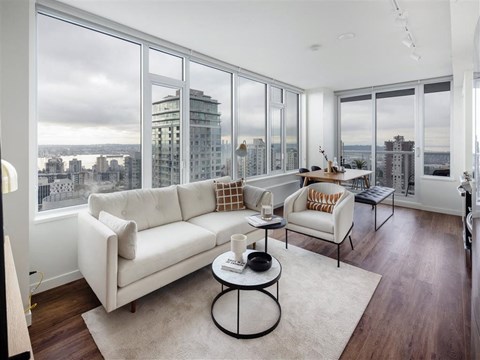 a living room with a view and a couch and a table