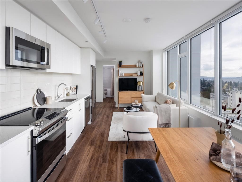 a kitchen and living room with a table
