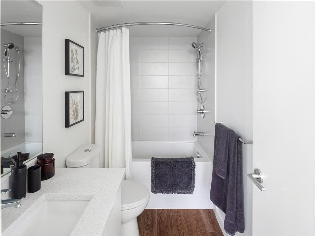 a bathroom with a sink toilet and a shower