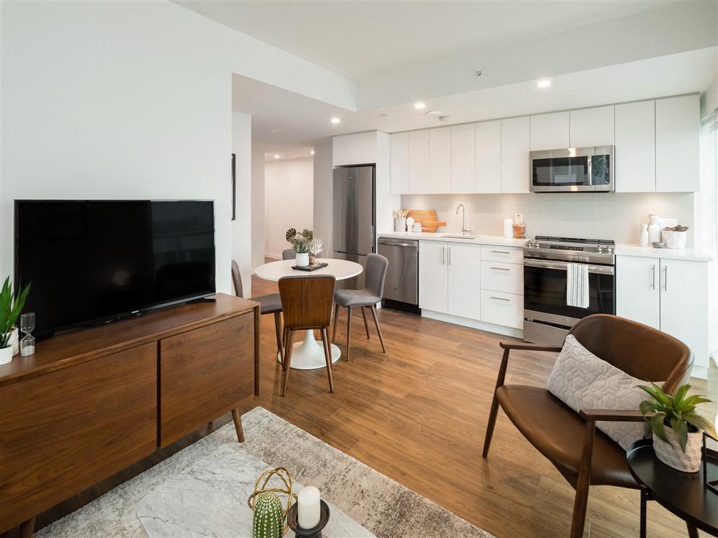 a living room with a table and a television