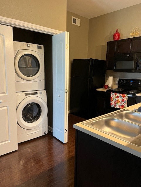 a kitchen with a washing machine and a sink