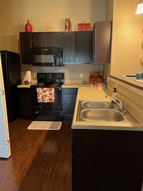 a small kitchen with a sink and a stove