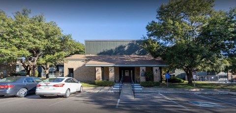 a building with cars parked in front of it