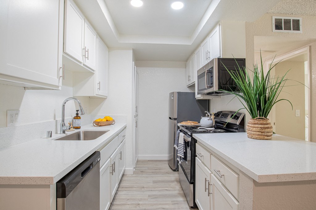 a kitchen with white cabinets and stainless steel appliances  at Metro 3610, Riverside, CA, 92505