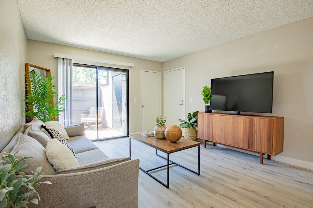 a living room with a couch and a coffee table  at Metro 3610, Riverside