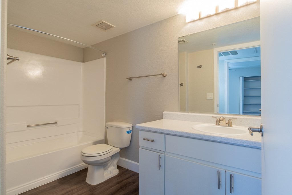 a bathroom with a toilet sink and bathtub