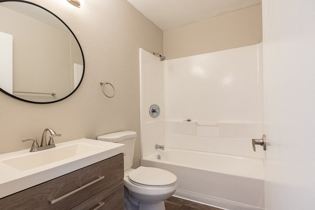 a bathroom with a toilet sink and bathtub