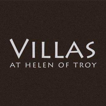 the white vilas at hell of troy font on a black background