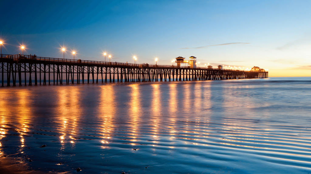 the pier at dusk at the beach