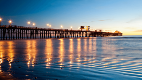 the pier at dusk at the beach
