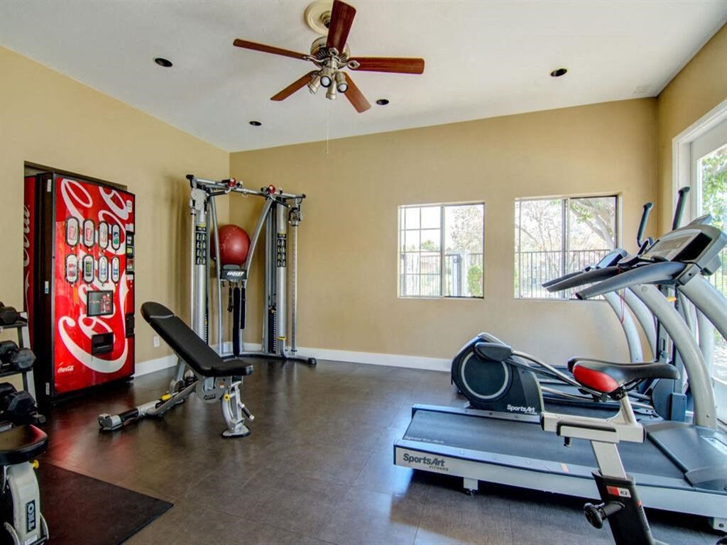 a home gym with a coke machine
