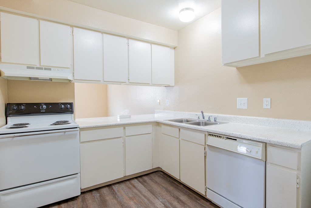 the preserve at ballantyne commons apartment kitchen with white appliances and white cabinets