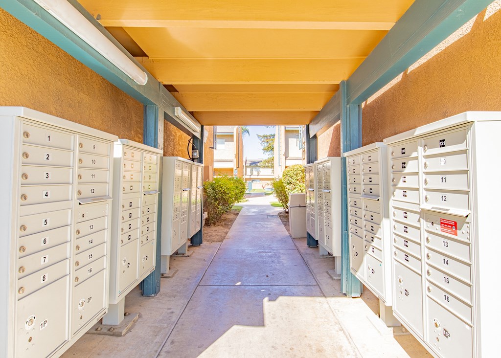 a row of mailboxes are lined up against a wall in a post office