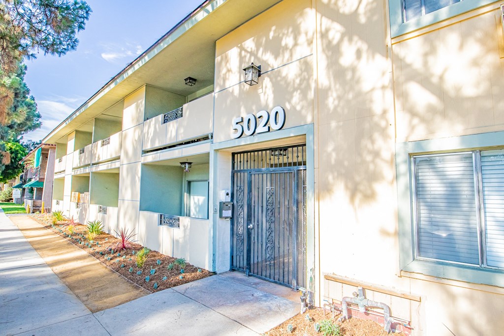 the entrance to an apartment building with a door
