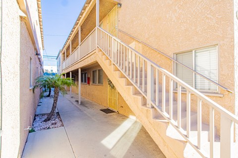 A building with a staircase leading to the second floor.