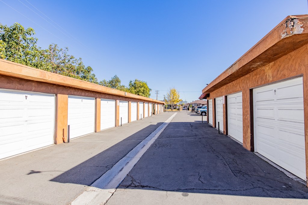 A long row of garage doors are closed.