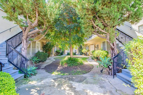 A house with a front yard and trees.