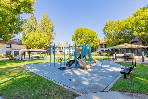 A playground with a blue slide and a yellow slide at Metro 3610, Riverside, 92505