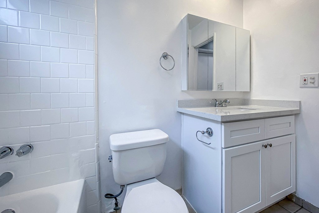 an empty bathroom with a toilet and a sink