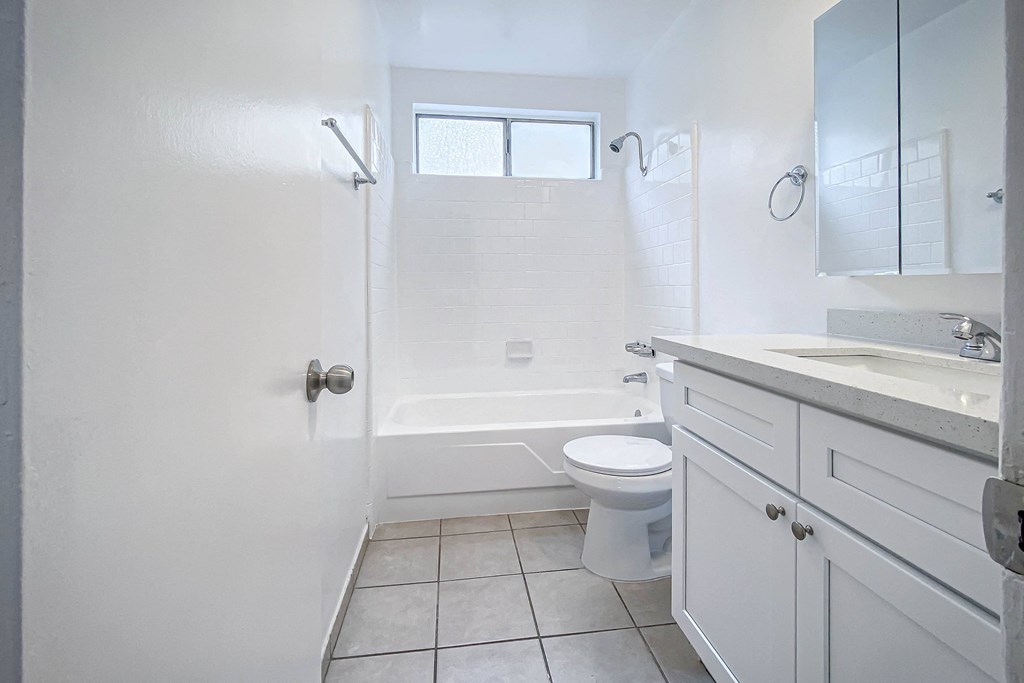 an empty bathroom with a toilet and a sink