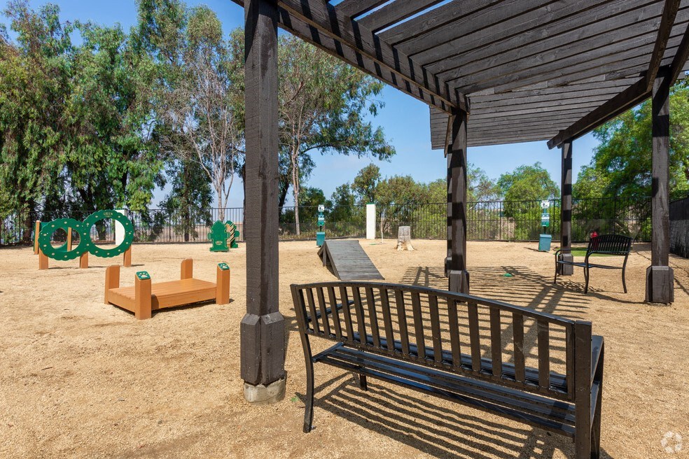 a park bench and a pavilion in a park