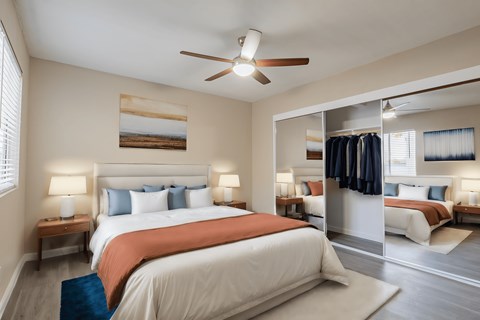 A bedroom with a large bed and a ceiling fan at Sofia Apartments, Tempe, 85283