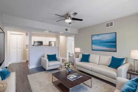 a living room with couches and a coffee table