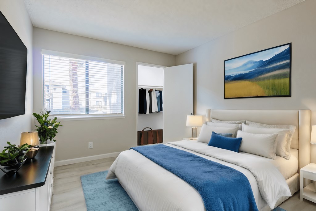 a bedroom with a bed and a dresser and a window