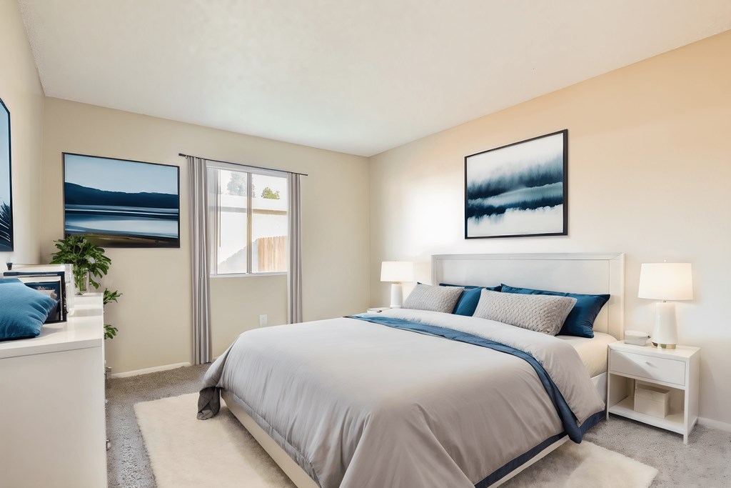 a bedroom with a bed and a window