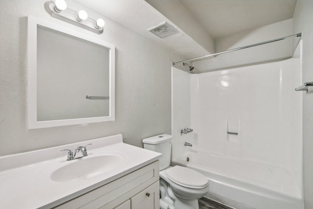 the preserve at ballantyne commons apartment bathroom with sink toilet and shower