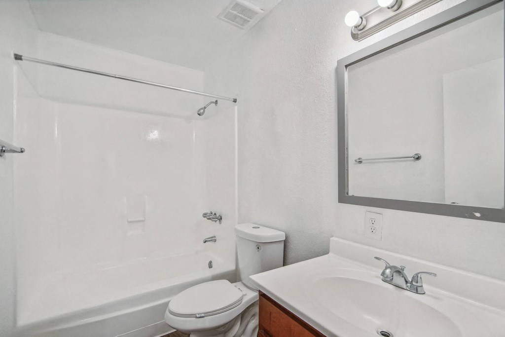 a bathroom with a sink toilet and a shower