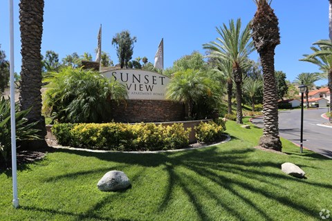 the sign for sunset view at the entrance to the sunset garden