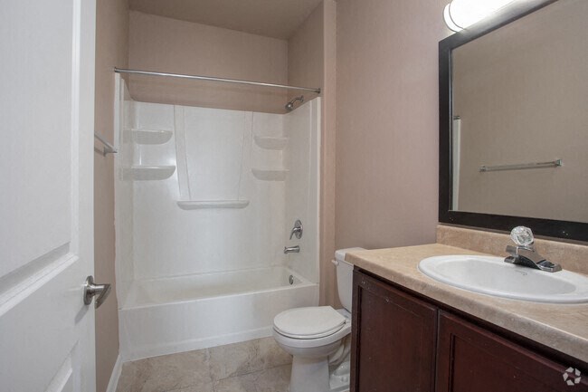 a bathroom with a sink toilet and a shower
