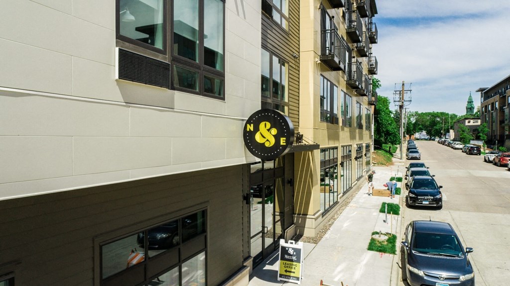 a building with a sign on the side of a street