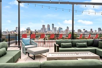 A patio with a view of the city skyline.