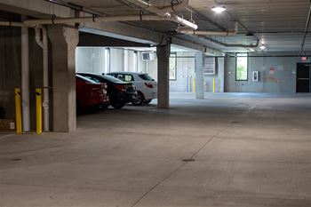A parking garage with cars parked in it.