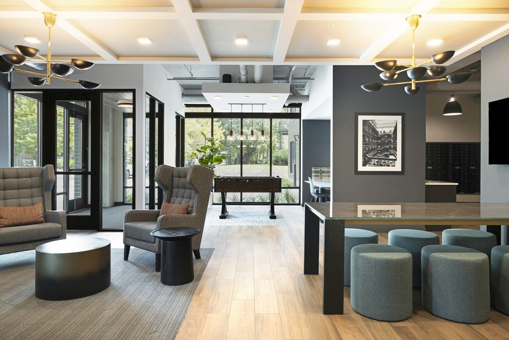 a lobby with chairs and a bar and a piano
