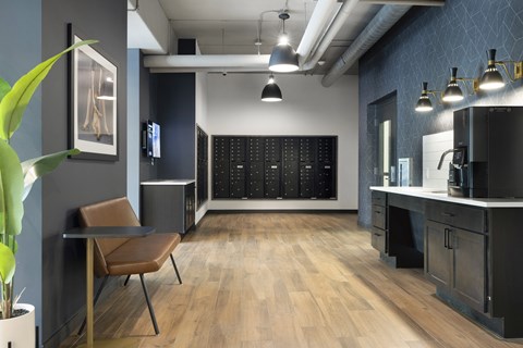 a room with a desk and a chair and a wall with a calendar