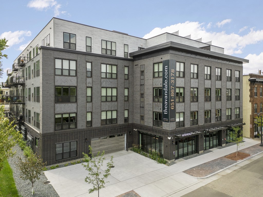 a large brick building with a sign on the side of it