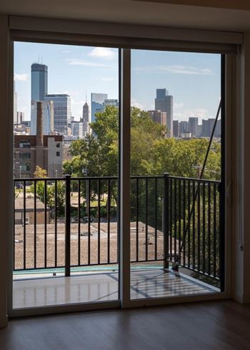 A view of a city skyline from a balcony.