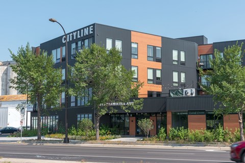 A modern building with the word "CITYLINE" on the top.